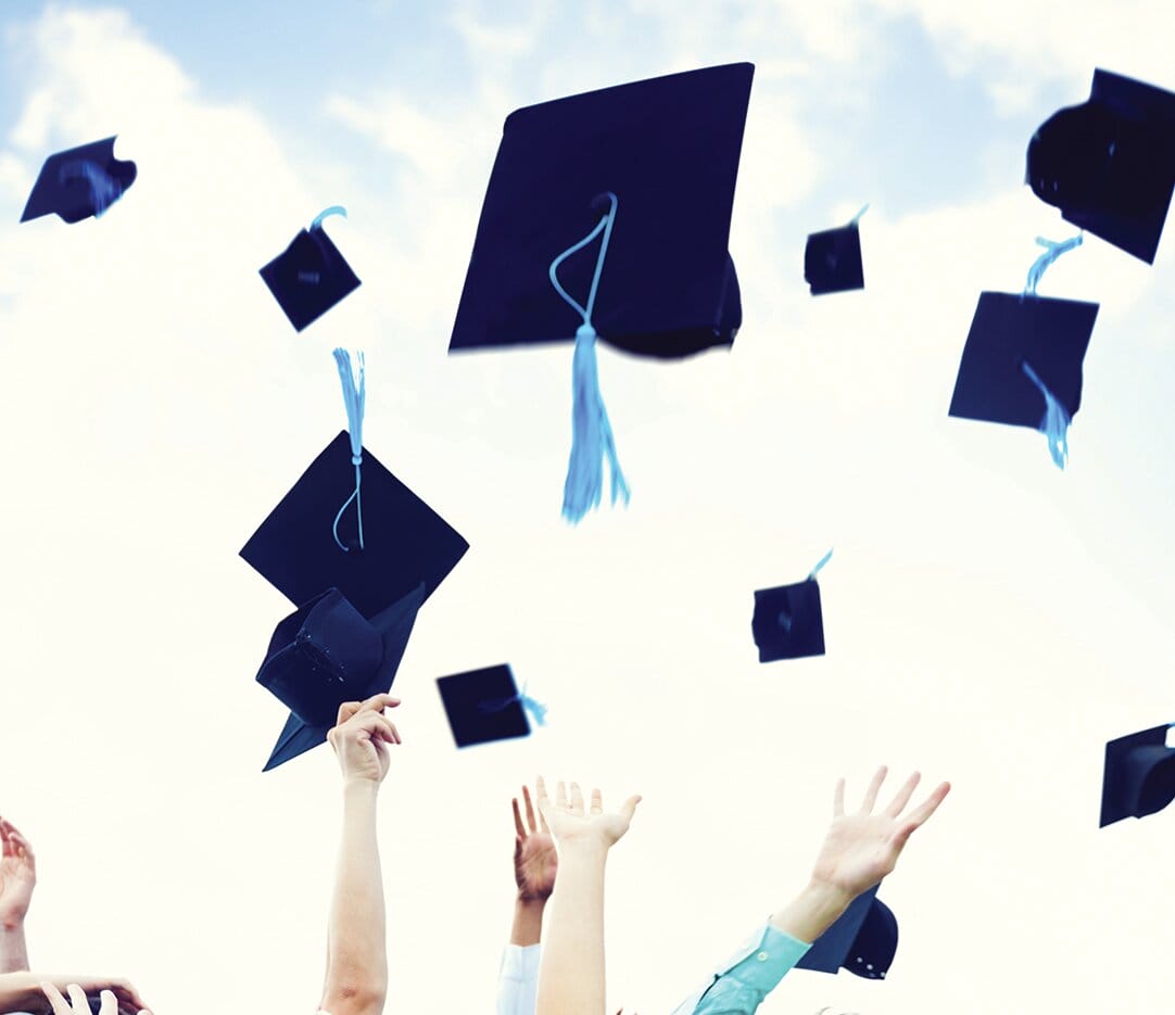 graduate hats flying