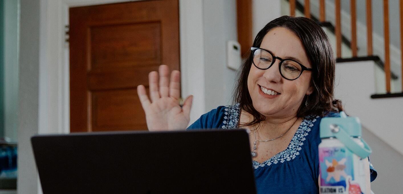 Teacher working with her laptop at home