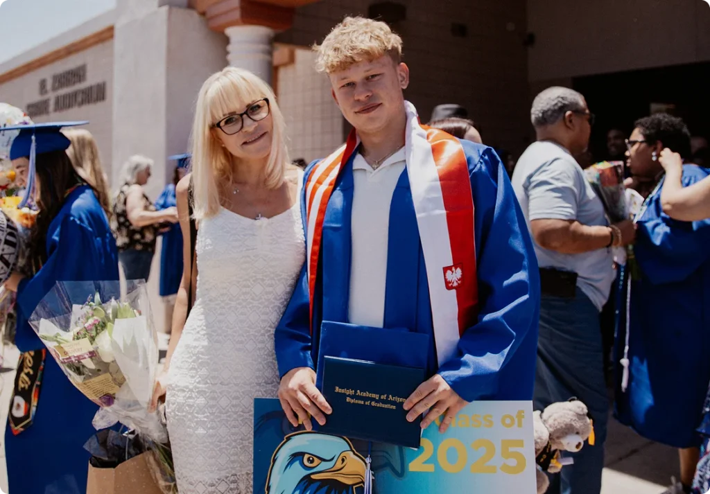 Woman next to her graduated son