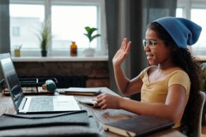 girl saying hi to virtual meeting