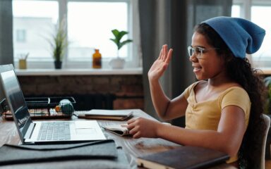 girl saying hi to virtual meeting